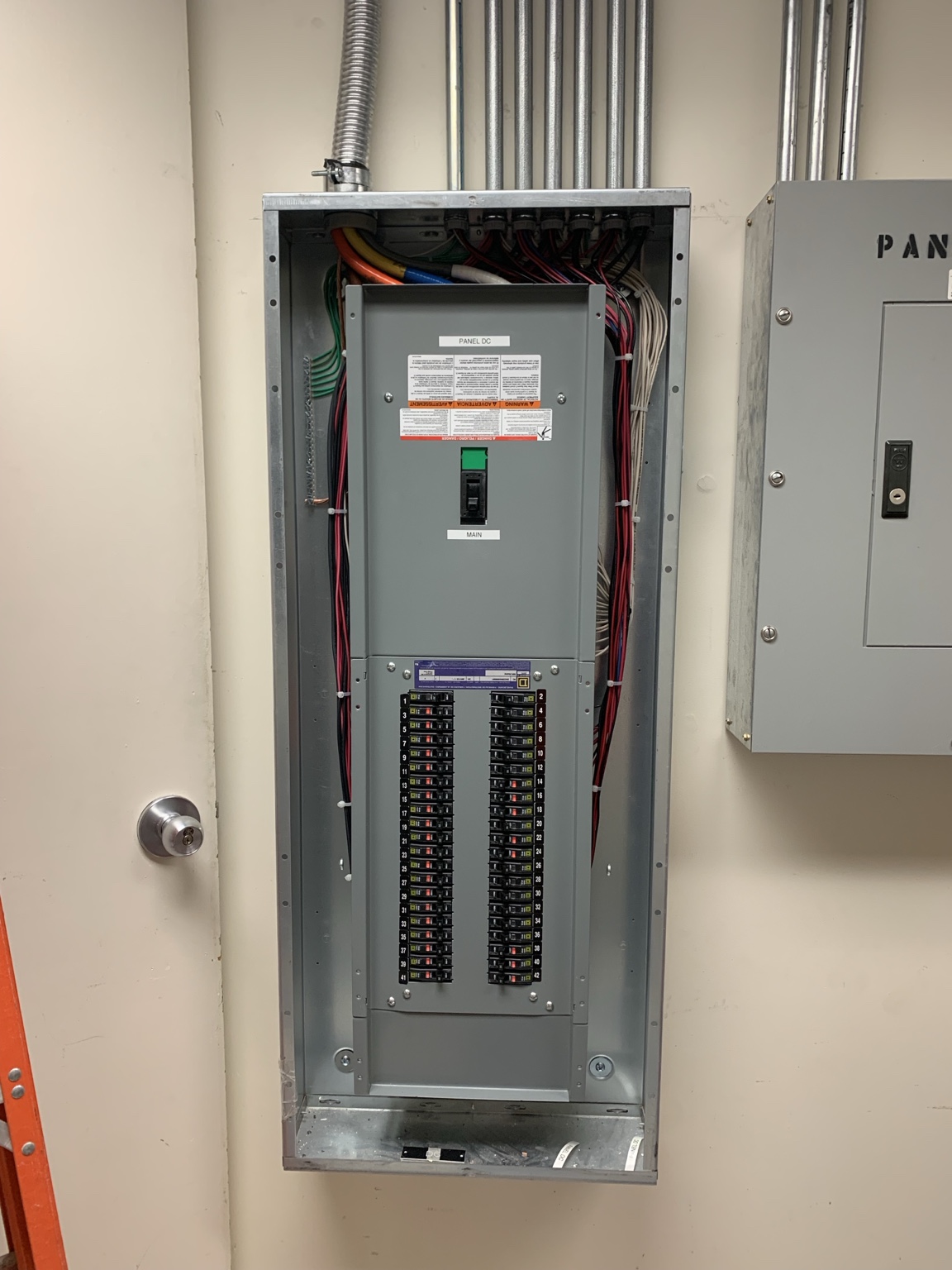 Installed breaker panel with neatly routed wiring